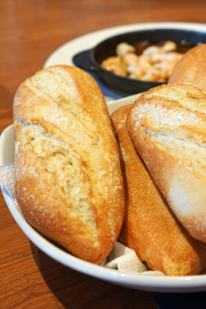 istock Close up Complimentary garlic bread and toast in appetizer basket 1409420481