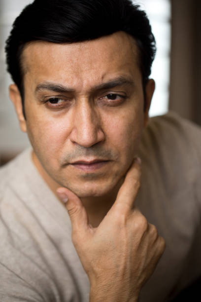 Portrait of an Indian young man looking at camera.