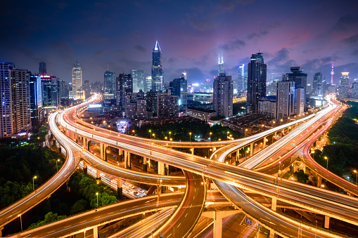 Shanghai elevated road junction and interchange overpass at night, Shanghai China