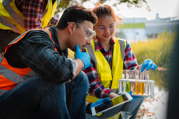 Scientists team collect water samples for analysis and research on water quality, environment with saving earth. Scientists team collect water samples for analysis and research on water quality, environment with saving earth. methodist stock pictures, royalty-free photos & images