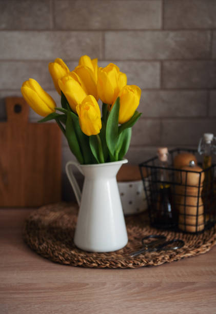 istock Beautiful tulip flowers  on table at kitchen 1409424272
