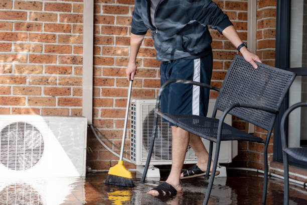 istock A man cleaning flooded balcony balcony after heavy rain 1409425515