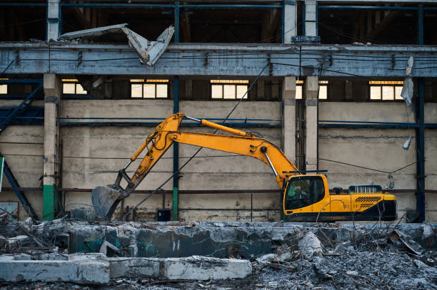 istock Hydraulic excavators at demolition site of industrial complex 1409427123