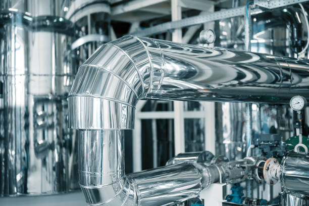 istock Shiny silver pipeline system and pressure meter at plant 1409427154