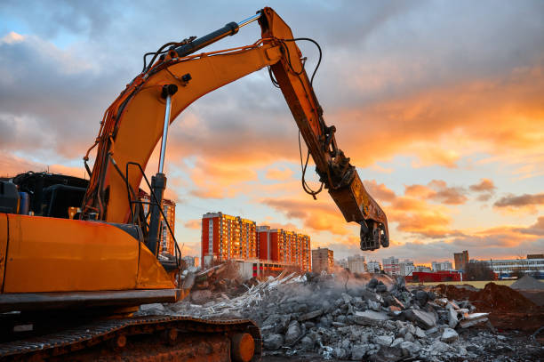 istock Excavator with concrete crusher on rig at demolition site 1409427169