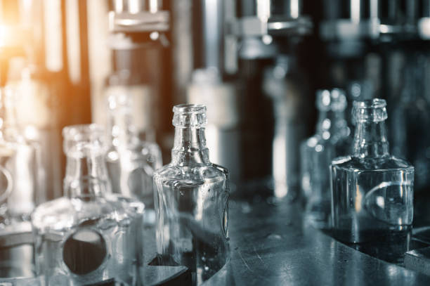 istock Automatic production line fills glass bottles with vodka 1409427184