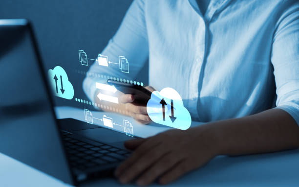 istock FTP(File Transfer Protocol) files receiver and computer backup copy. File sharing isometric. Exchange information and data with internet cloud technology. Digital system for transferring documents. 1409427278