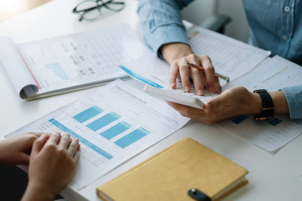 istock Group of accounting consultant working by calculator and management data and analyze financial document of company 1409429736