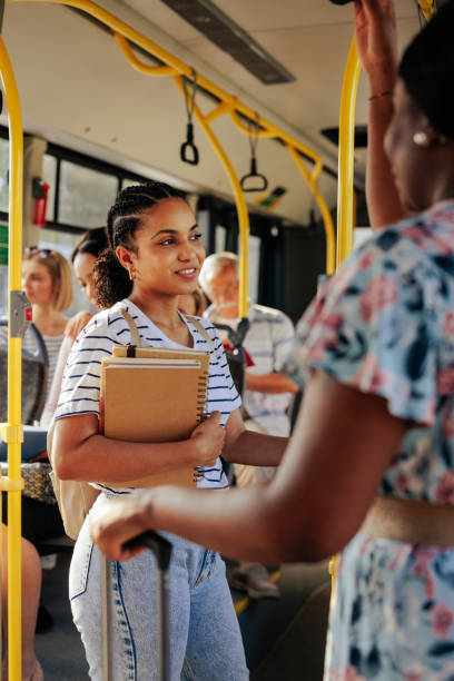 istock Student with books in public bus 1409431382