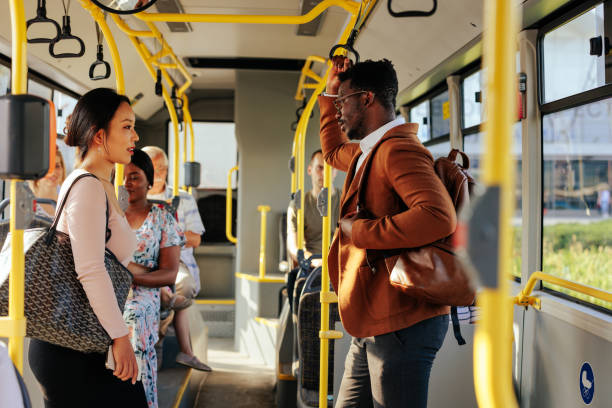 istock Asian woman and black man riding bus 1409431396