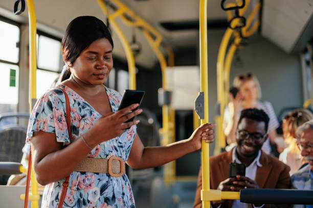 istock African American woman texting in shuttle bus 1409431402