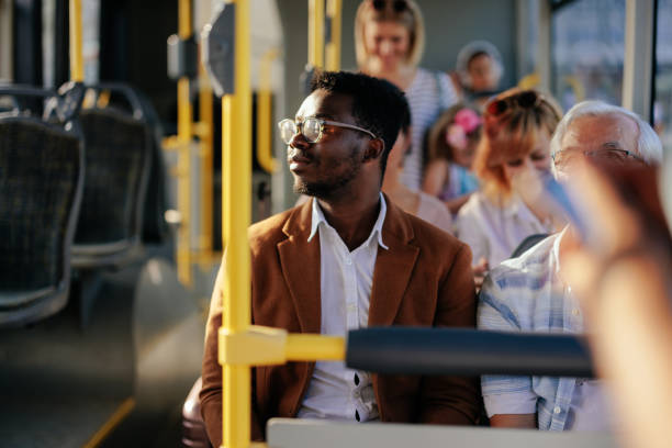istock Young black man riding city public bus 1409431411