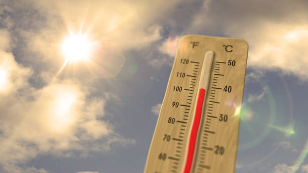 istock Thermometer on blue sky and shining sun illustration 1409432119
