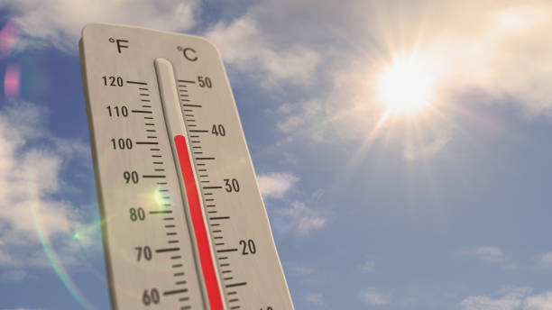 istock Thermometer on blue sky and shining sun illustration 1409432147