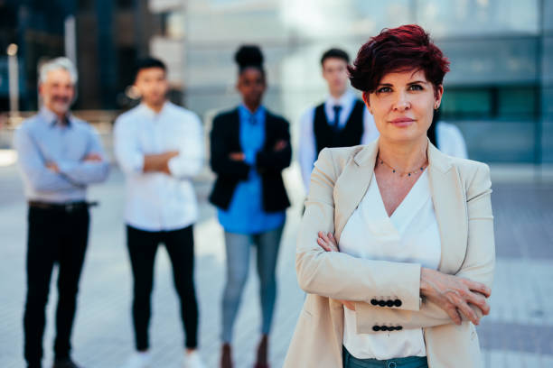 istock Businesswoman with team 1409432164