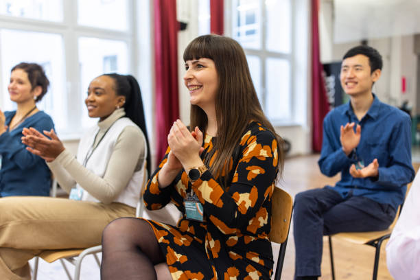 istock Happy businesspeople applauding good presentation in office 1409432889