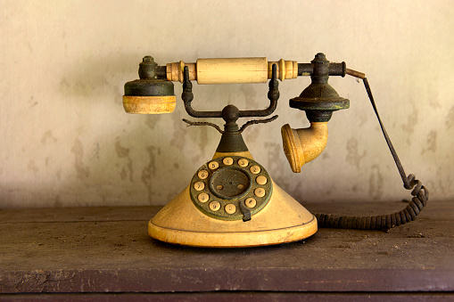 Old-fashioned phone isolated on white background.