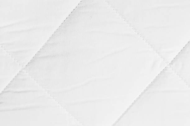 istock Quilted texture of white fabric for orthopedic mattress 1409437199