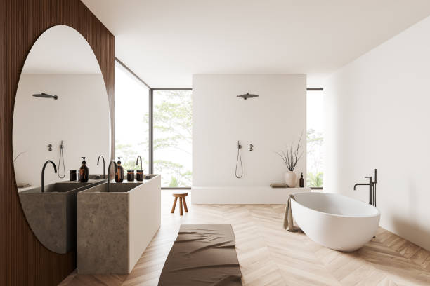 istock Light bathroom interior with bathtub, shower, sink and panoramic window 1409438537