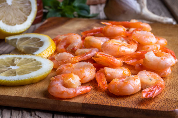 istock Roasted shrimps with lemon, garlic, pepper and basil 1409438656