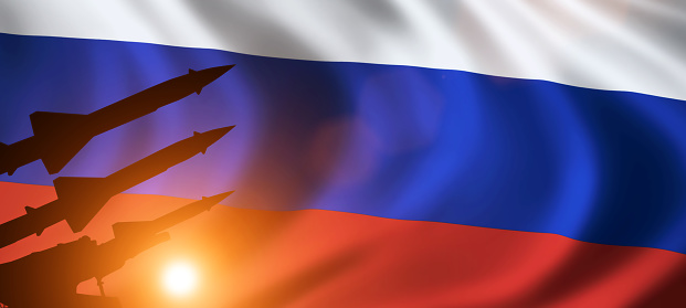 Silhouette of missiles on Russia flag. News concept background.