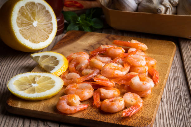 istock Roasted shrimps with lemon, garlic, pepper and basil 1409438678