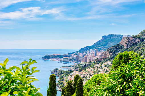 lanscape of riviera coast, turquiose water, flowers and blue sky of cote dAzur at summer day, France