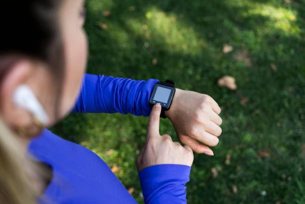 istock A woman checking smart watch during a hike 1409439292