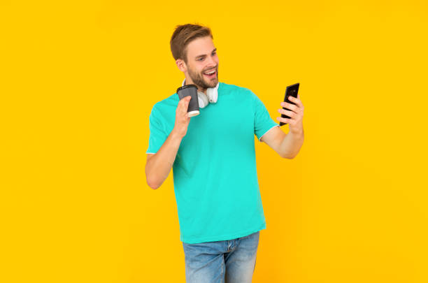 istock blogger use smartphone. guy working online. typing and texting. check sms and email. 1409440324