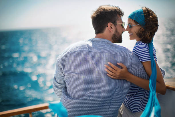 istock Young couple on a sailing cruise. 1409440629