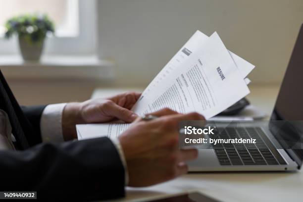 Businessman Or Hr Manager Is Reviewing Resume Information Stock Photo - Download Image Now