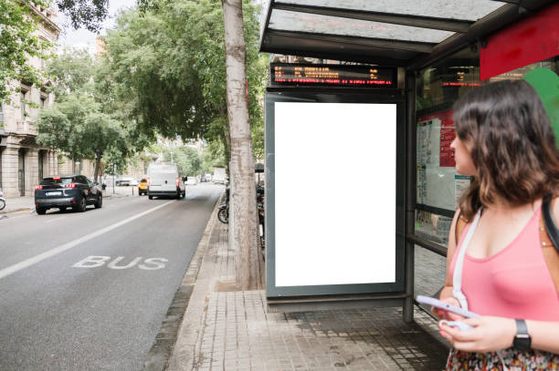 bus stop with blank billboard - bushalte stockfoto's en -beelden