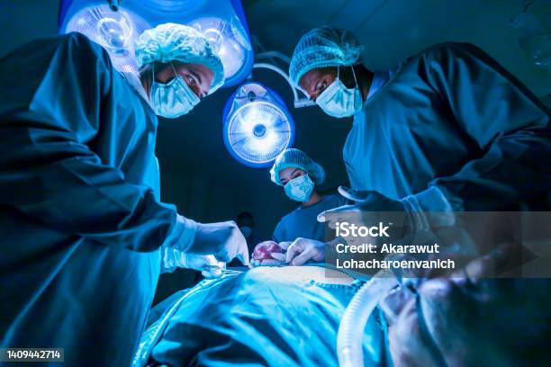 Team Of Surgeon Doctors Are Performing Heart Surgery Operation For Patient From Organ Donor To Save More Life In Emergency Surgical Room Stock Photo - Download Image Now