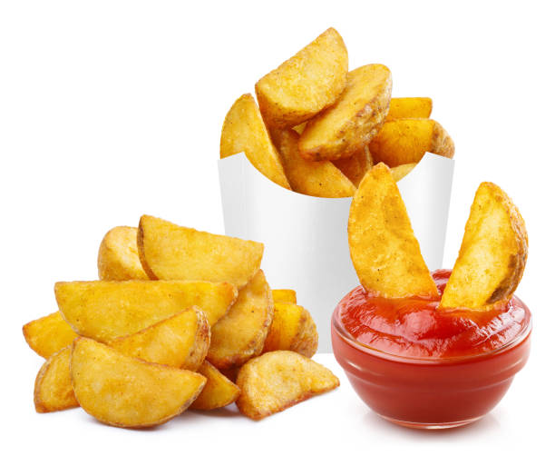 istock Delicious fried potato wedges with tomato ketchup on white 1409443490