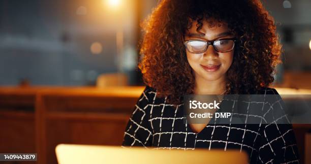 Black Business Woman Using Laptop Working Late In Modern Office With Copyspace Smiling African American Female Working Overtime Searching For New Project Lawyer Using Internet Research Or Study Stock Photo - Download Image Now