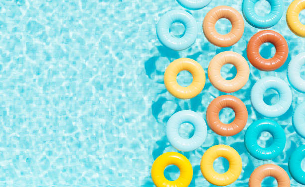 istock Colorful swim tubes in pool on sunny day 1409444321