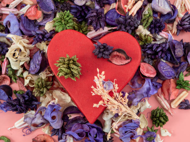 istock Heart shaped boxes and flower confetti or potpourri on a pink background. 1409445100