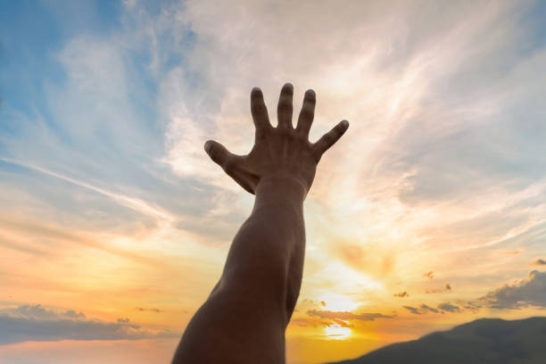 istock open human hand in the sunset 1409445160