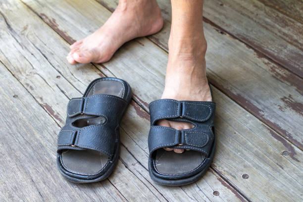 old man human floor wood sandals.