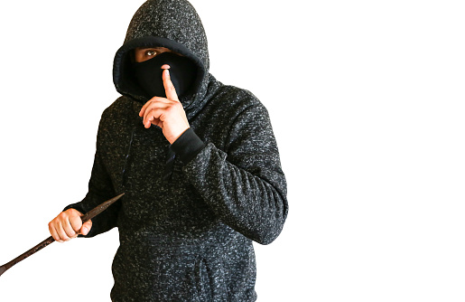 Criminal with crowbar near the doors. Robber in dark hoodie. Isolated on white background.