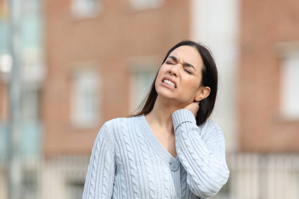 istock Stressed woman is suffering neck ache complaining alone 1409450621
