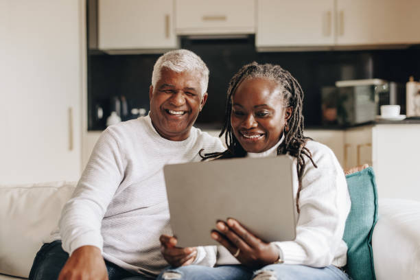istock Retired couple having a video call on a digital tablet 1409450718