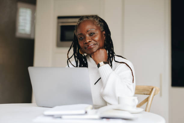 istock Senior businesswoman working from home 1409450814