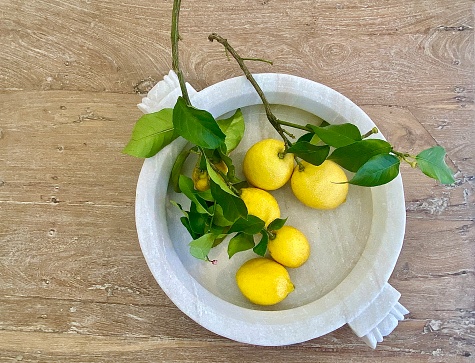 Fresh yellow lemons on a wooden background. diet, vitamin c