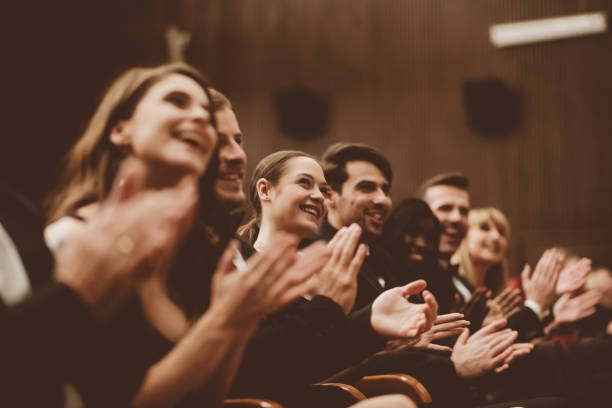 istock Excited audience clapping in the theater 1409453390