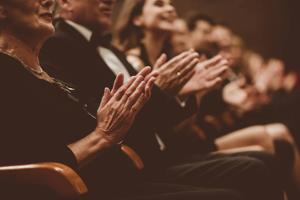 istock Excited audience clapping in the theater, focus on hands 1409453746