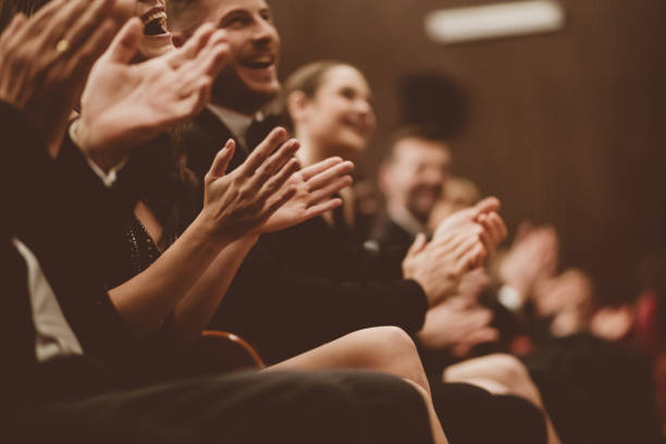 istock Excited audience clapping in the theater, focus on hands 1409453982