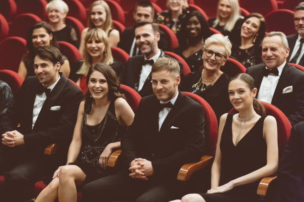 istock Happy audience sitting in opera house 1409454050