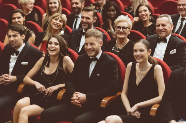 istock Happy audience sitting in opera house 1409454153