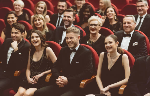 istock Happy audience sitting in opera house 1409454242